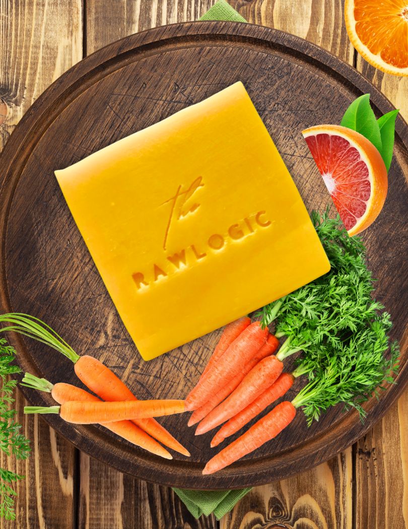 Rawlogic’s Fresh Carrot Juice Soap beautifully placed with natural ingredients for a luxurious skincare experience