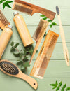 Wooden handle neem comb placed in a serene setting to emphasize natural care