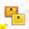 Two soap boxes labeled 'Citrus Burst' and 'Golden Glow' on a white background with a yellow flower.