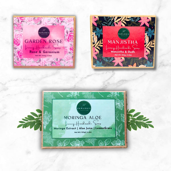 Three soap packaging boxes with floral designs and product names on a white background.