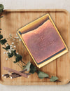 * Close-up of The RawLogic Manjistha Oud Handmade Soap showing its rich texture and natural formulation