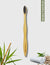 Front view of Rawlogic Bamboo Toothbrush featuring activated charcoal bristles for natural teeth whitening and oral care